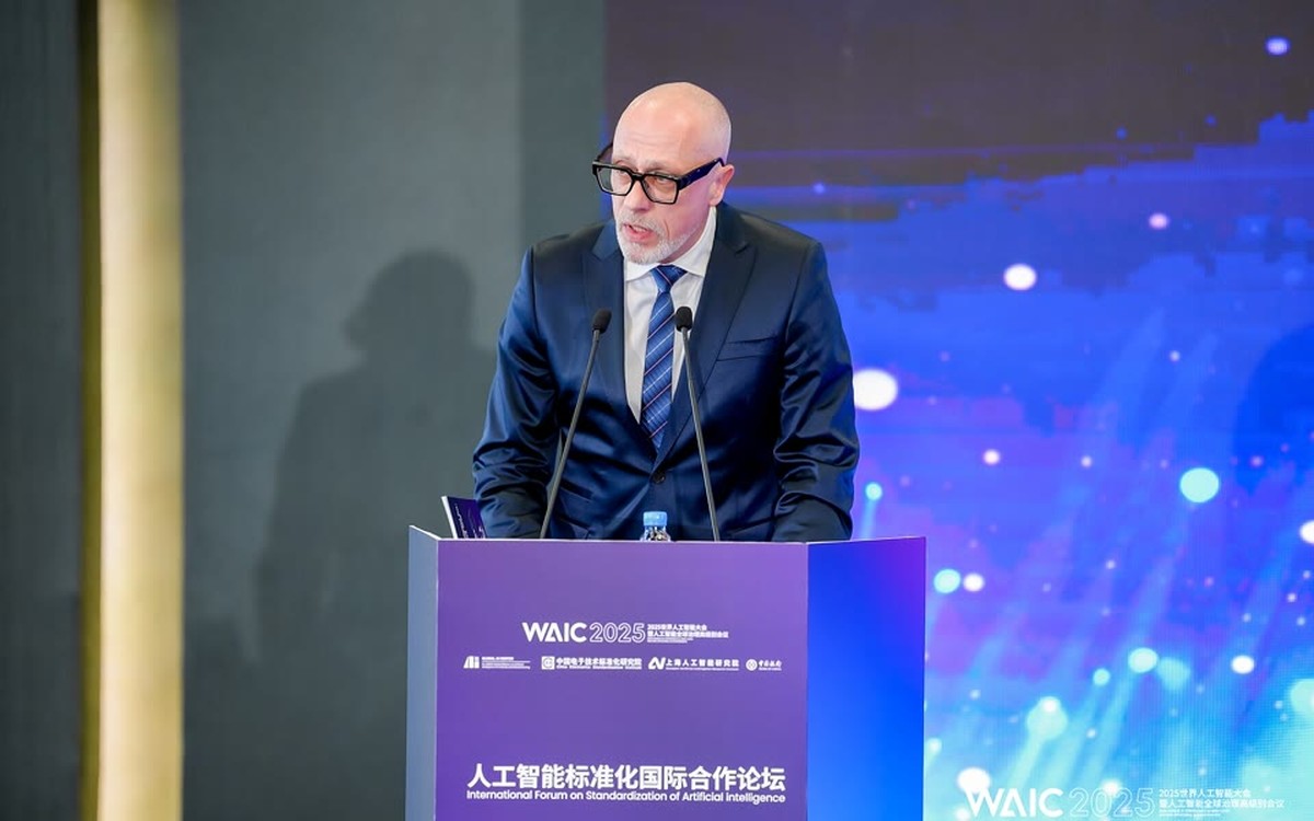 Speaker at a podium during the 2025 World AI Conference in Shanghai
